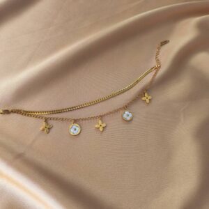 مراقبت از گردنبند"، "نگهداری دستبند"، "تمیز کردن زیورآلات". دستبند استیل دولاین طلایی طرح ونکلیف و لوزی برند لوکس لویی ویتون | مناسب کادو و هدیه دخترانه